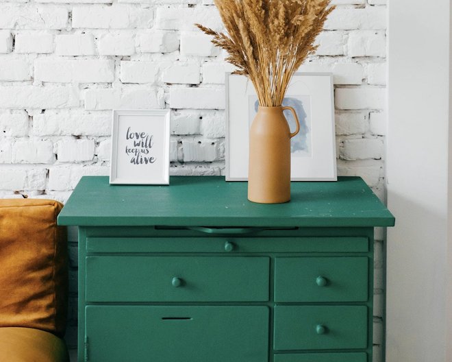 A green drawer with decorative items